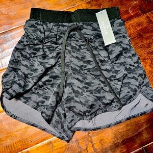 Concealed carry athletic shorts with garment